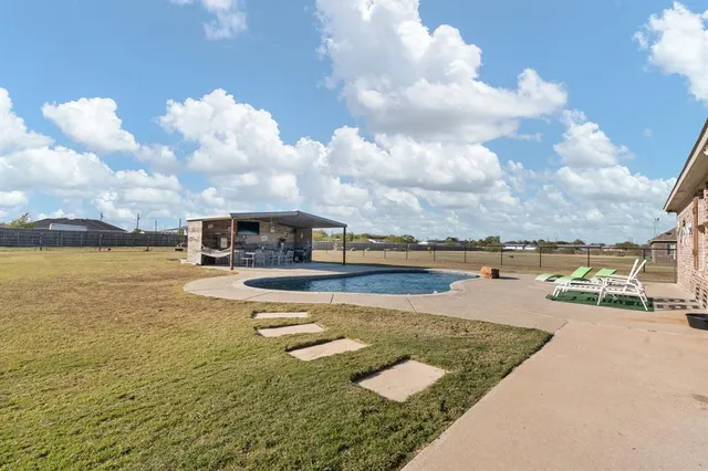 a view of a swimming pool with an ocean view