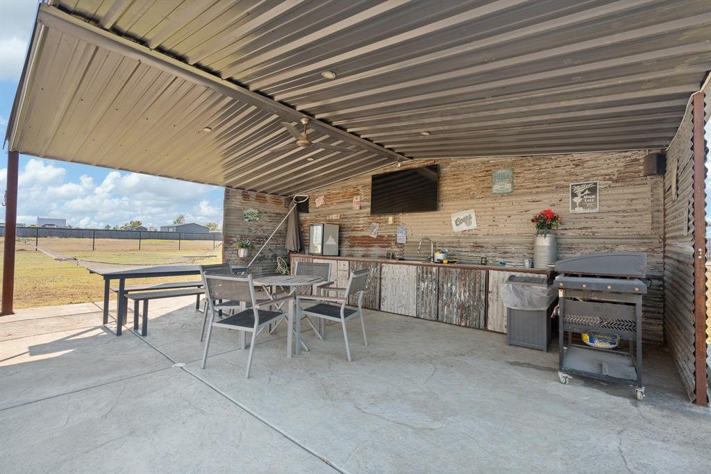 6033 Berry Ridge Lane Joshua, TX 76058 - Photo 29 of 39 a view of a patio with table and chairs