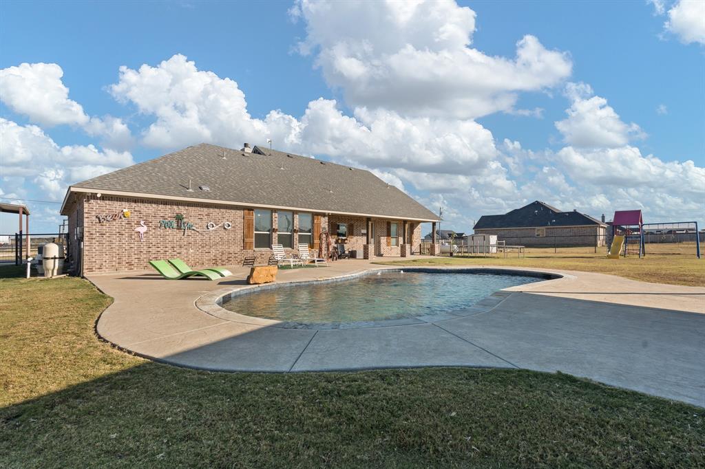 6033 Berry Ridge Lane Joshua, TX 76058 - Photo 34 of 39 a view of a house with swimming pool and sitting space