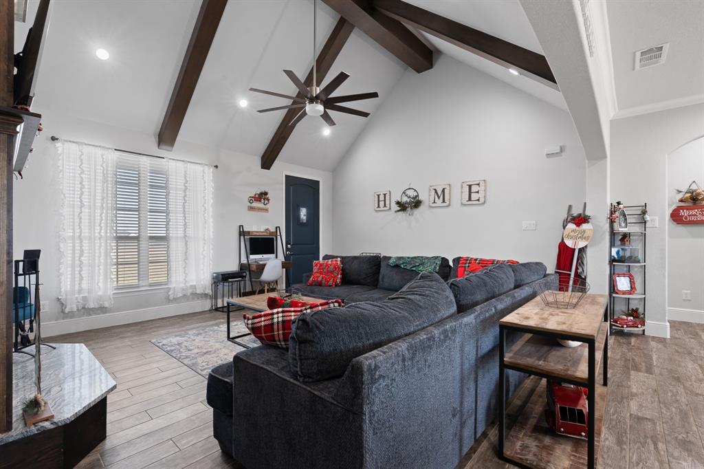6033 Berry Ridge Lane Joshua, TX 76058 - Photo 4 of 39 a living room with furniture and a flat screen tv