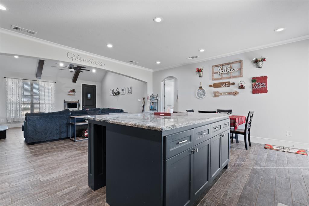 6033 Berry Ridge Lane Joshua, TX 76058 - Photo 9 of 39 a kitchen with counter top space and dining table