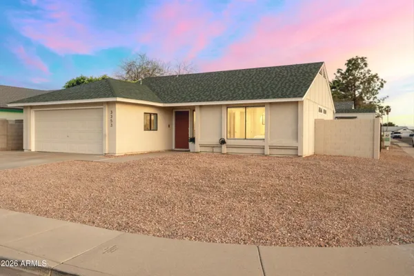 front view of a house with a yard