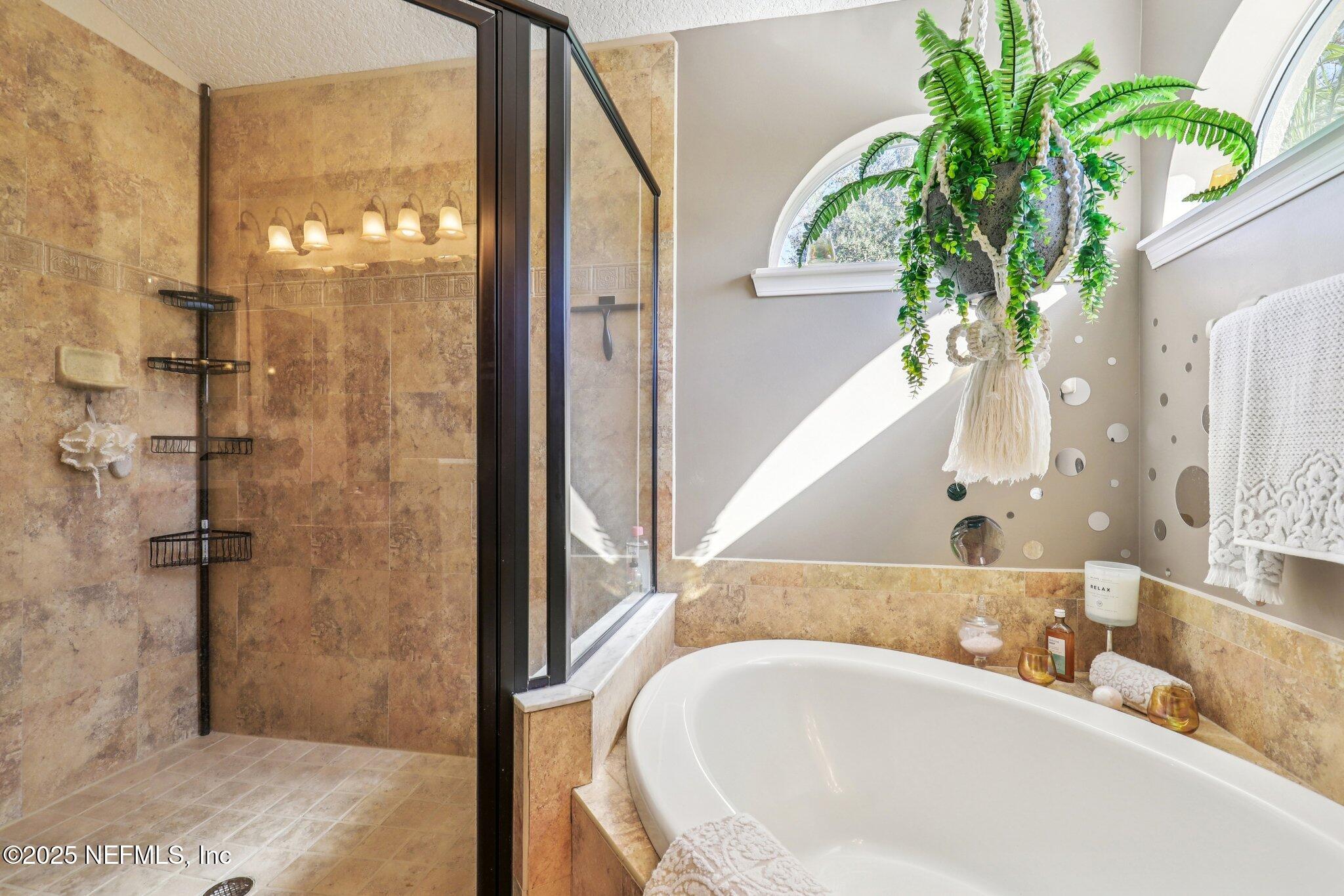 1693 Sanctuary Way Fleming Island, FL 32003 - Photo 19 of 33 a close view of a bathtub in a bathroom