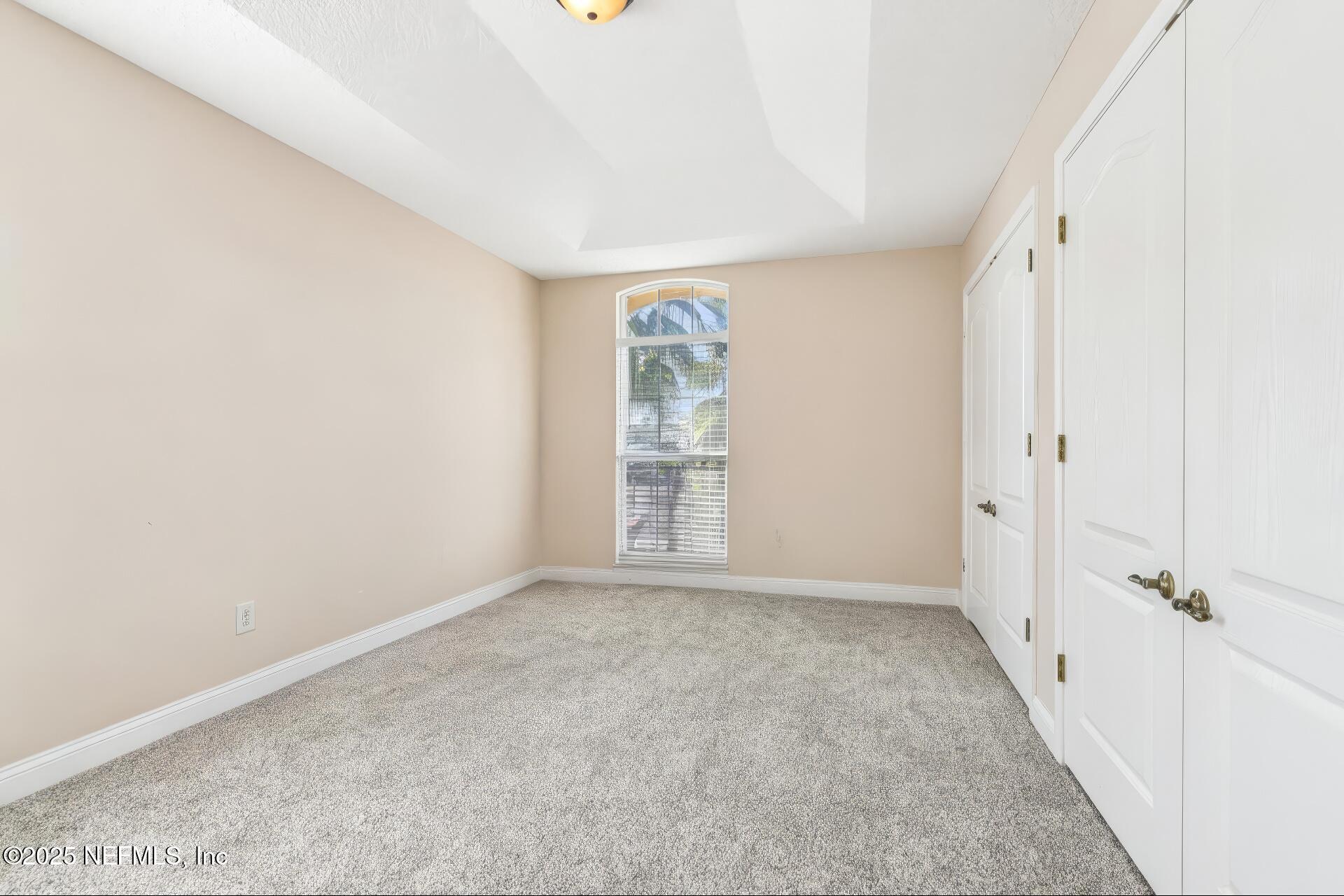 1693 Sanctuary Way Fleming Island, FL 32003 - Photo 20 of 33 an empty room with windows