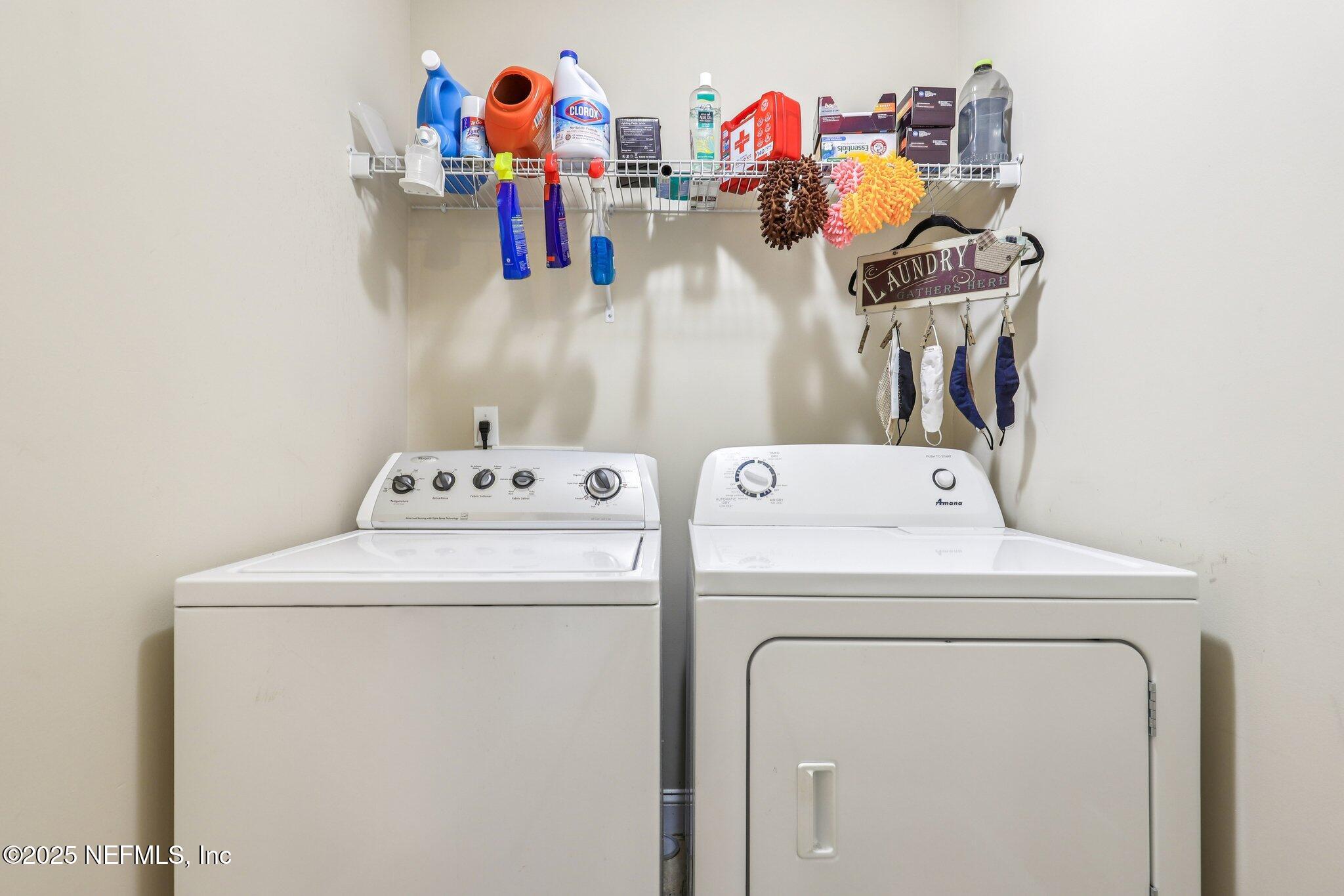 1693 Sanctuary Way Fleming Island, FL 32003 - Photo 23 of 33 a utility room with dryer and washer
