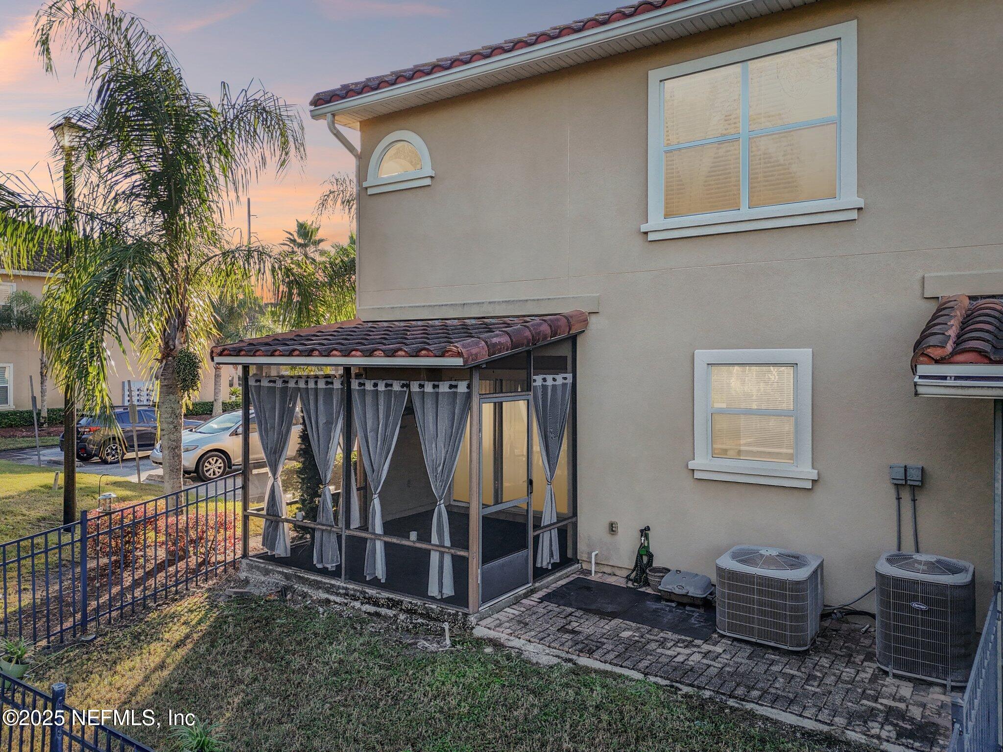 1693 Sanctuary Way Fleming Island, FL 32003 - Photo 24 of 33 a house view with a backyard space