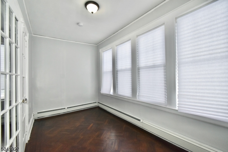 519 Clinton Place, Unit 2R Newark, NJ 07112 - Photo 2 of 15 a view of an empty room with a window