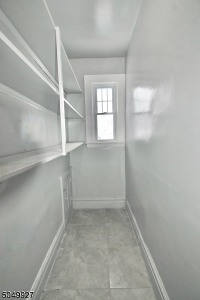 519 Clinton Place, Unit 2R Newark, NJ 07112 - Photo 8 of 15 an empty room with windows
