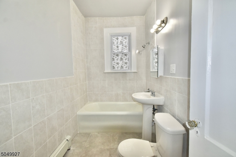 519 Clinton Place, Unit 2R Newark, NJ 07112 - Photo 10 of 15 a bathroom with a sink and bathtub