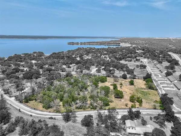 an aerial view of a house with a lake view