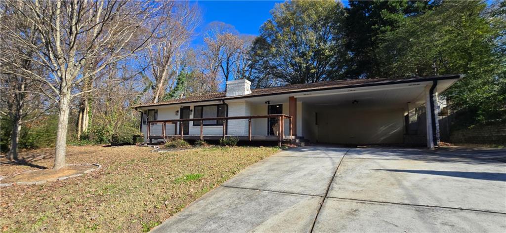 a view of house with a yard
