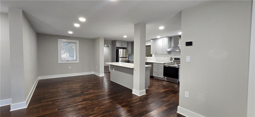 3594 Abbotts Bridge Road Duluth, GA 30096 - Photo 11 of 30 a view of kitchen with wooden floor and electronic appliances