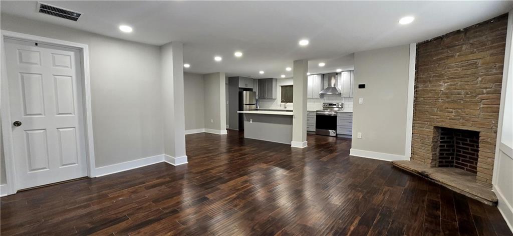 3594 Abbotts Bridge Road Duluth, GA 30096 - Photo 12 of 30 a view of kitchen with livingroom and fireplace