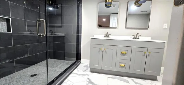 a bathroom with a shower sink and mirror
