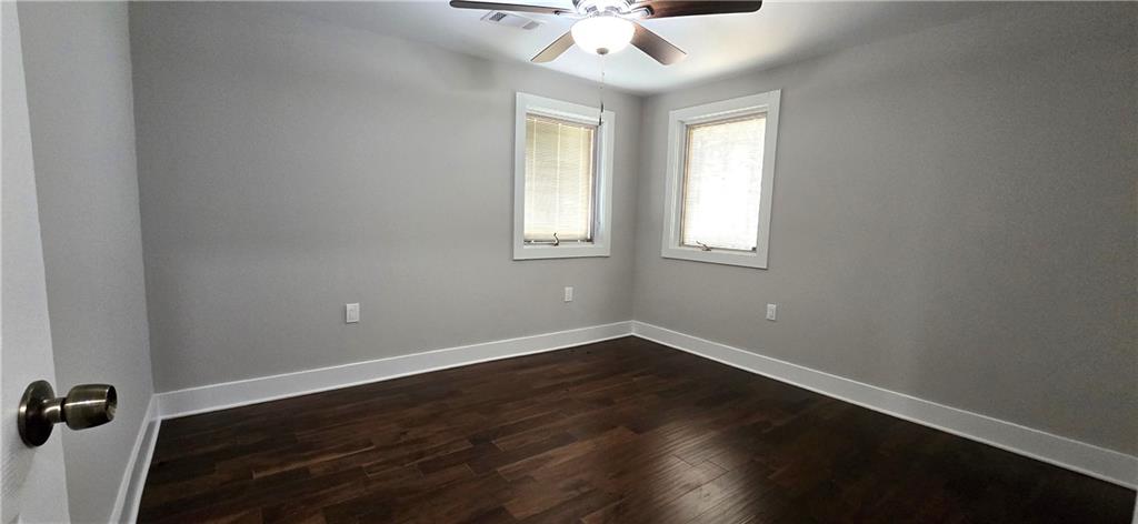 3594 Abbotts Bridge Road Duluth, GA 30096 - Photo 18 of 30 an empty room with wooden floor and windows
