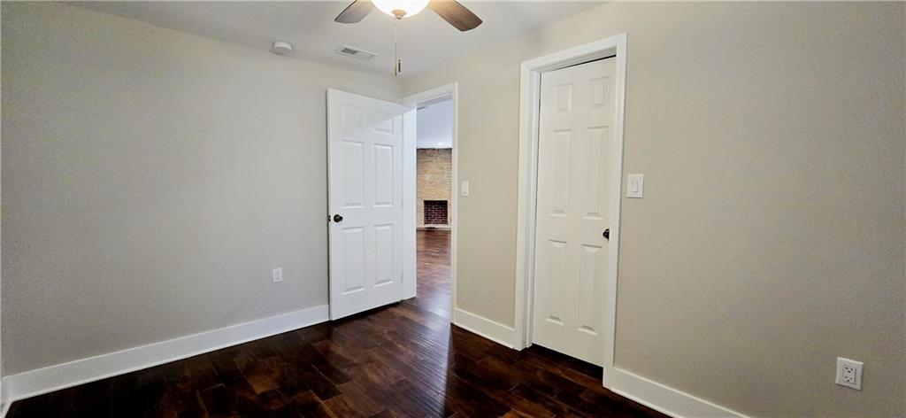 3594 Abbotts Bridge Road Duluth, GA 30096 - Photo 19 of 30 an empty room with wooden floor closet and windows