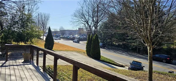 a view of a balcony with trees