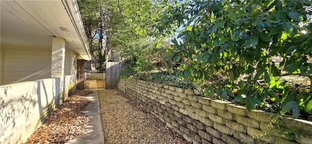 a view of a pathway with a yard