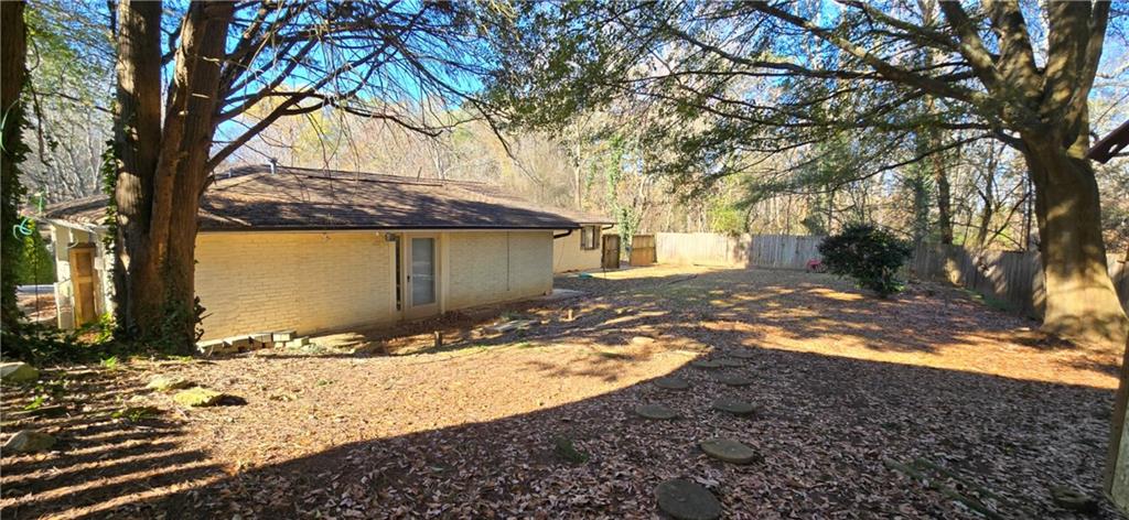3594 Abbotts Bridge Road Duluth, GA 30096 - Photo 28 of 30 a view of a yard covered in snow
