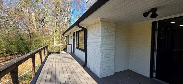 a view of balcony with wooden floor