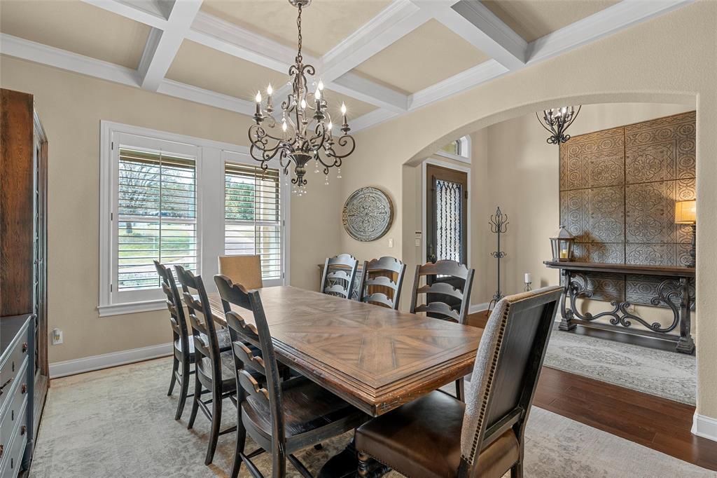 14690 Chapel Road Lorena, TX 76655 - Photo 6 of 40 a view of a dining room with furniture a chandelier and wooden floor