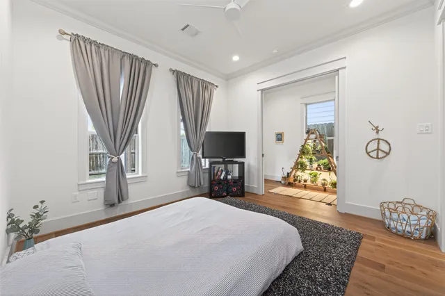 a bathroom with a double vanity sink toilet mirror and shower
