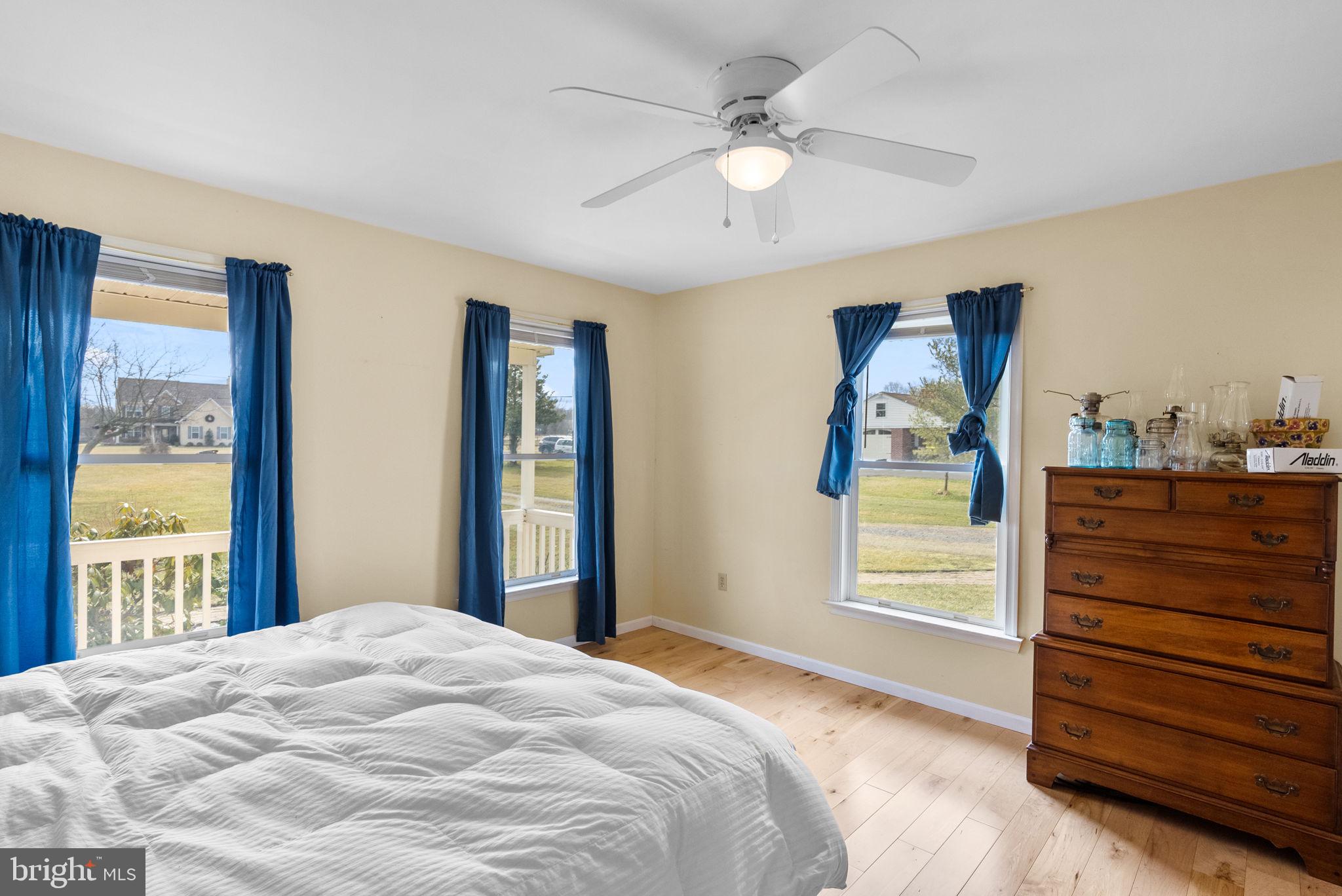 602 Quarry Road Perkasie, PA 18944 - Photo 14 of 39 a bedroom with a bed and a chandelier