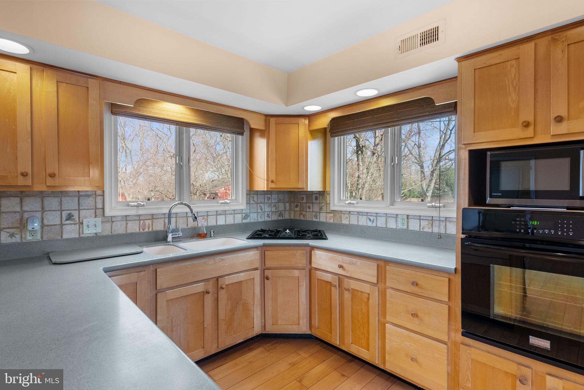602 Quarry Road Perkasie, PA 18944 - Photo 8 of 39 a kitchen with sink cabinets and window