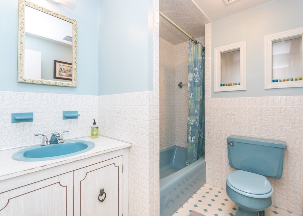 43 Alfreton Road Needham, MA 02494 - Photo 22 of 34 a bathroom with a sink toilet and shower