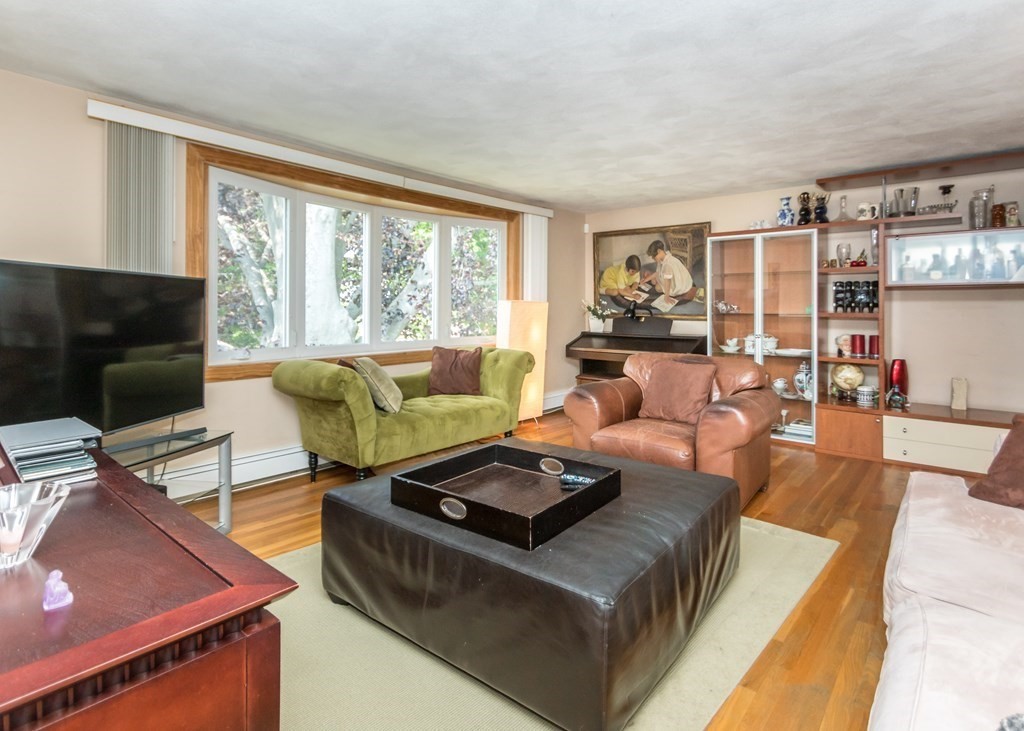 43 Alfreton Road Needham, MA 02494 - Photo 3 of 34 a living room with furniture and a flat screen tv