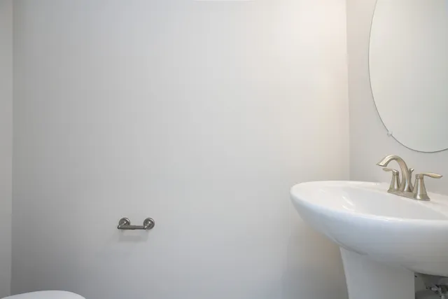 a bathroom with a sink and mirror