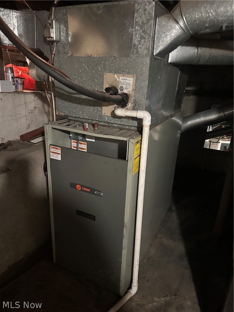 595 Jersey Ridge Road Zanesville, OH 43701 - Photo 16 of 20 Utility room featuring heating unit