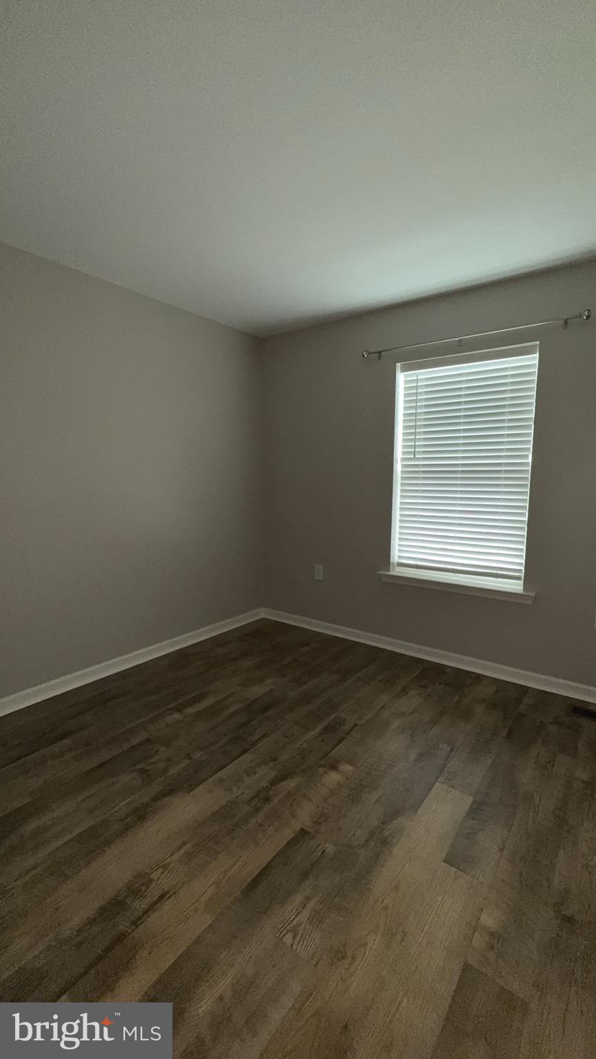 23 Landis Court Falling Waters, WV 25419 - Photo 32 of 45 an empty room with wooden floor and windows