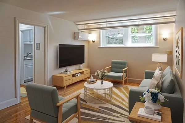 a living room with furniture and a flat screen tv
