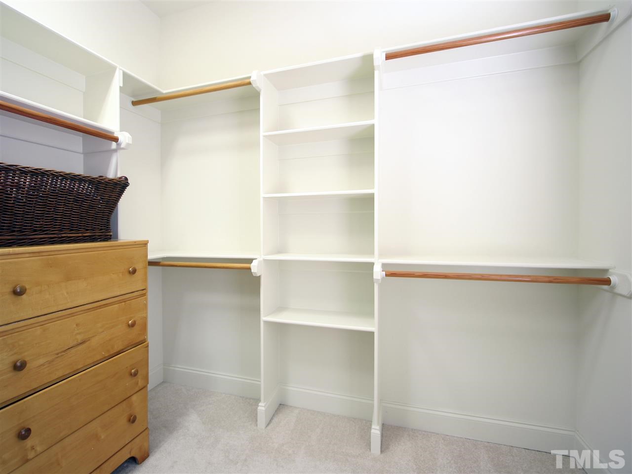1205 Verde Farm Road Raleigh, NC 27603 - Photo 21 of 25 The builder’s attention to detail carries through to the closets with custom-designed wood shelving.