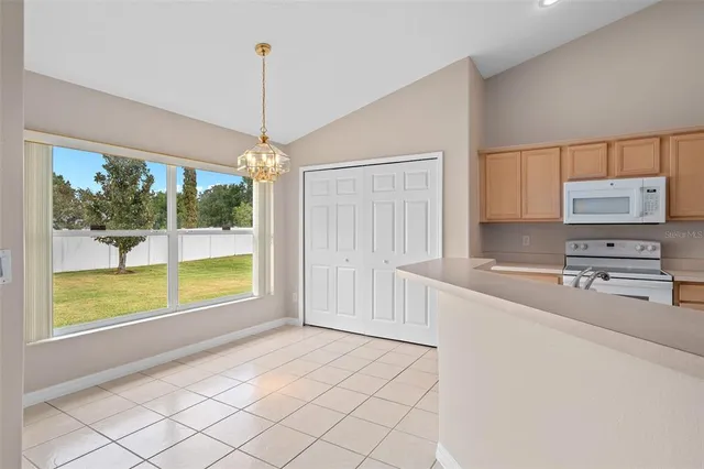 a spacious bathroom with a granite countertop sink a mirror and a