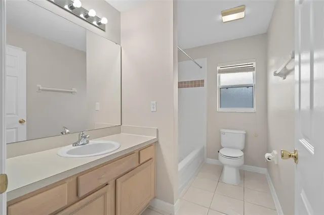 a front view of a house with a yard table and chairs