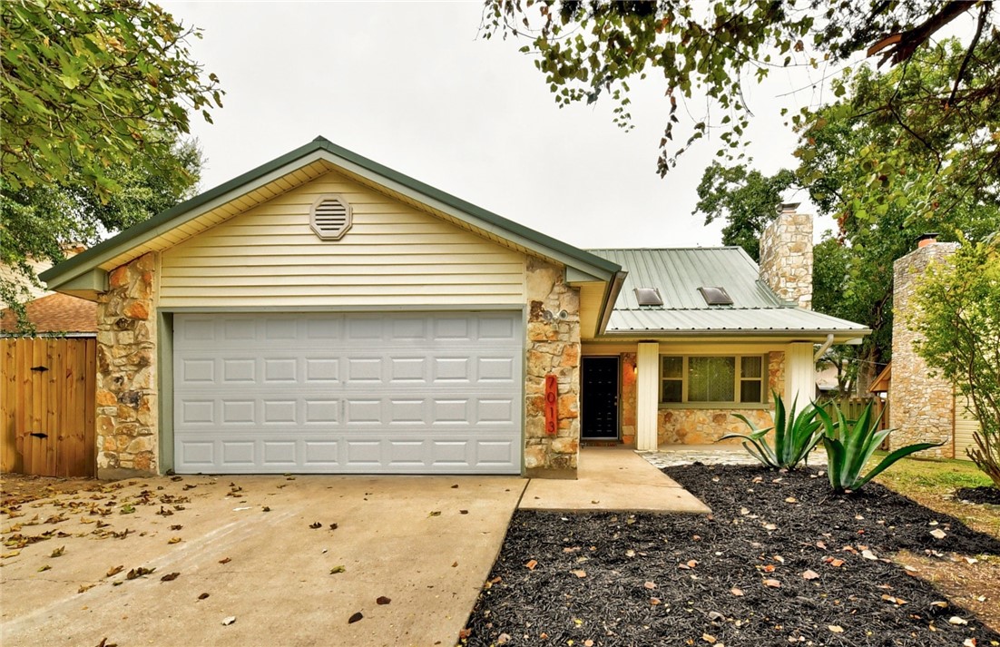 7013 Bill Hughes Road Austin, TX 78745 - Photo 1 of 1 a front view of a house