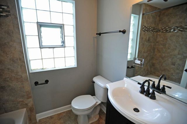 2633 West 99th Street Chicago, IL 60655 - Photo 11 of 17 a bathroom with a sink toilet and a mirror