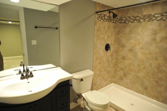 2633 West 99th Street Chicago, IL 60655 - Photo 15 of 17 a bathroom with a sink toilet and shower