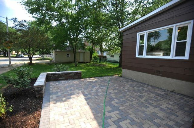 2633 West 99th Street Chicago, IL 60655 - Photo 16 of 17 a view of a yard with plants and large trees