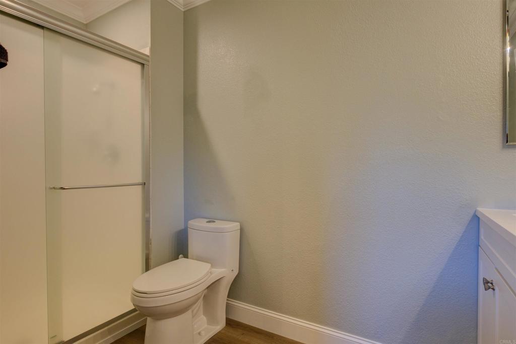 8942 Fletcher Valley Dr. Santee, CA 92071 - Photo 20 of 32 a white toilet sitting next to a shower