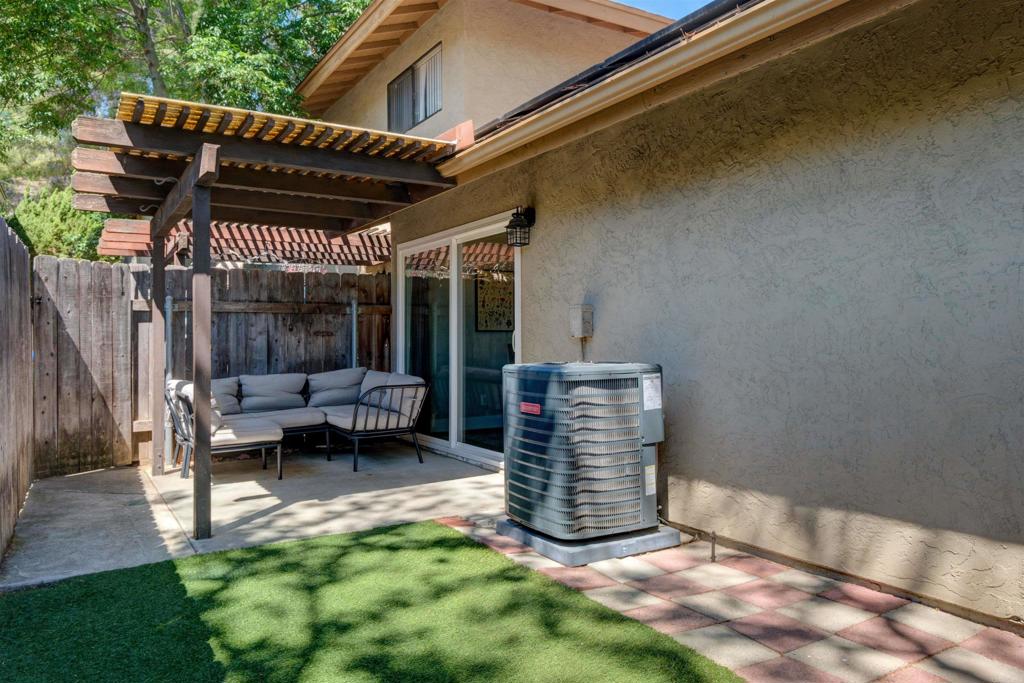 8942 Fletcher Valley Dr. Santee, CA 92071 - Photo 24 of 32 a view of patio with a table and chairs under an umbrella