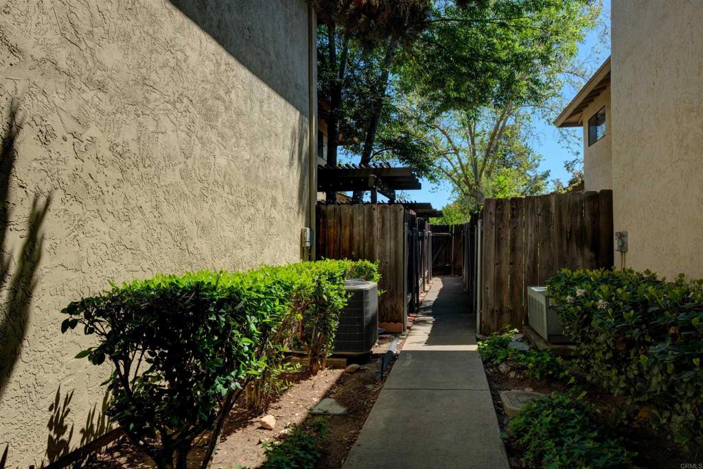 8942 Fletcher Valley Dr. Santee, CA 92071 - Photo 26 of 32 a view of a back yard with flower plants