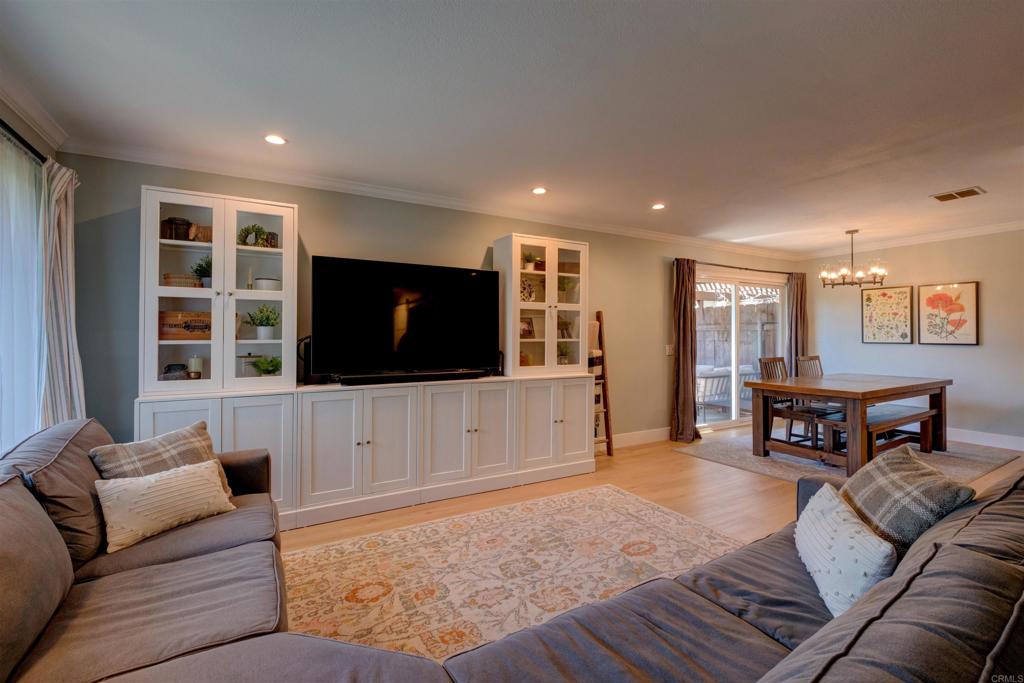 8942 Fletcher Valley Dr. Santee, CA 92071 - Photo 3 of 32 a living room with furniture and a flat screen tv