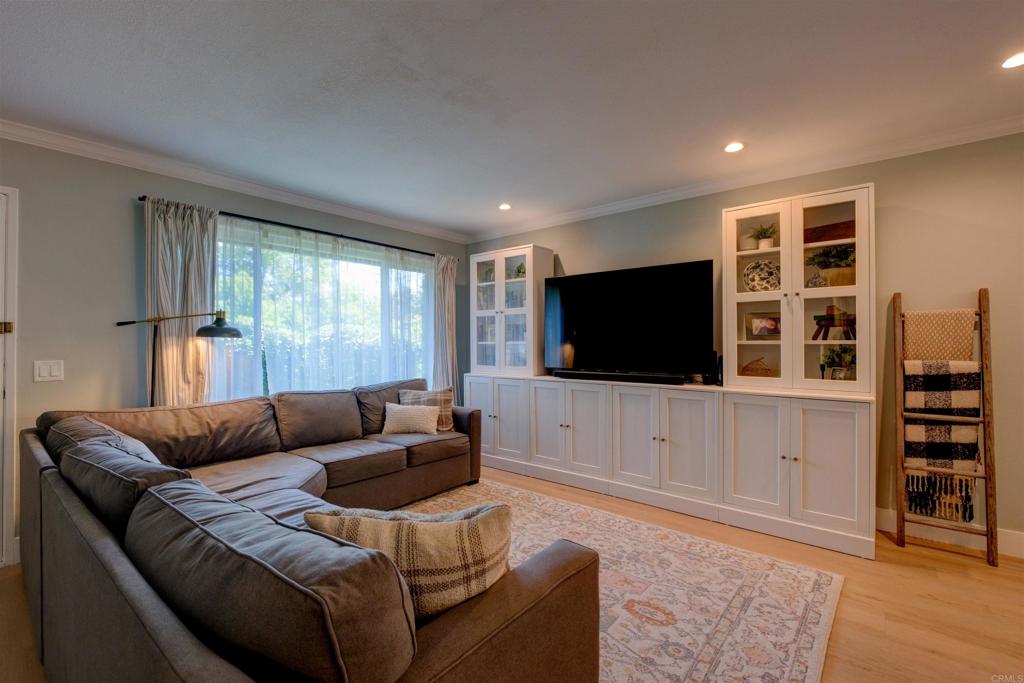 8942 Fletcher Valley Dr. Santee, CA 92071 - Photo 4 of 32 a living room with furniture and a flat screen tv