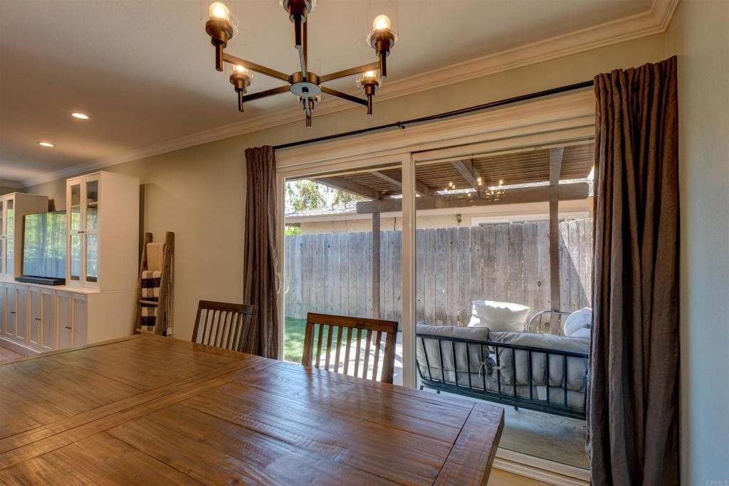 8942 Fletcher Valley Dr. Santee, CA 92071 - Photo 7 of 32 a view of a hallway with wooden floor and door