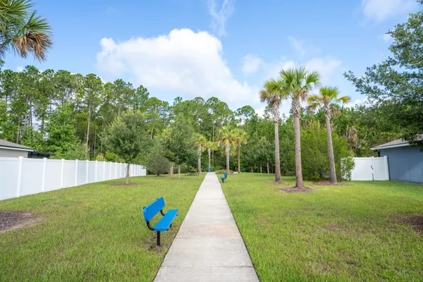 a view of backyard with green space