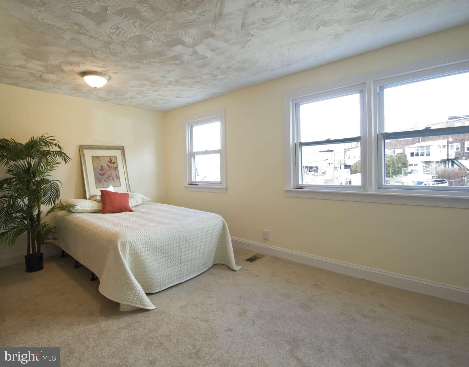 329 Grove Park Road Baltimore, MD 21225 - Photo 16 of 19 a bedroom with a bed and a window