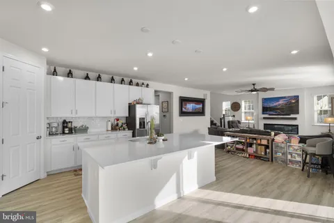 a kitchen with counter top space cabinets and appliances